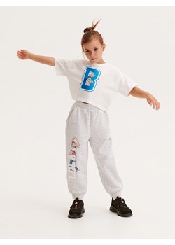 Reserved - Bawełniany t-shirt Looney Tunes - złamana biel ze sklepu Reserved w kategorii Bluzki dziewczęce - zdjęcie 163482474