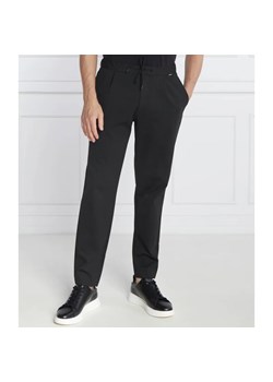 Calvin Klein Spodnie dresowe COMFORT KNIT PLEAT | Tapered fit ze sklepu Gomez Fashion Store w kategorii Spodnie męskie - zdjęcie 164326110