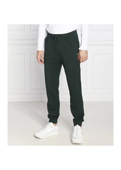 GUESS Spodnie dresowe Adam | Regular Fit ze sklepu Gomez Fashion Store w kategorii Spodnie męskie - zdjęcie 164330353