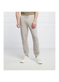 GUESS Spodnie dresowe Adam | Relaxed fit ze sklepu Gomez Fashion Store w kategorii Spodnie męskie - zdjęcie 164335643