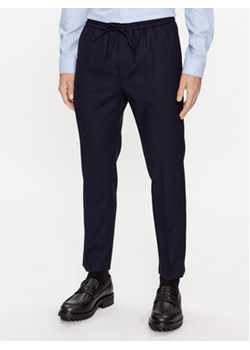 Calvin Klein Spodnie materiałowe K10K109956 Granatowy Regular Fit ze sklepu MODIVO w kategorii Spodnie męskie - zdjęcie 165533981