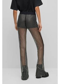 HUGO Spodnie Heruki-1 hugo x bella poarch | flare fit ze sklepu Gomez Fashion Store w kategorii Spodnie damskie - zdjęcie 166156470