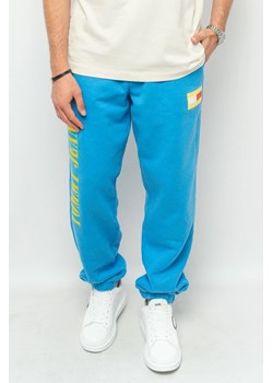 spodnie dresowe męskie tommy jeans dm0dm14931 niebieski ze sklepu Royal Shop w kategorii Spodnie męskie - zdjęcie 166431890