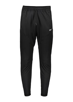 Reebok Spodnie dresowe w kolorze czarnym ze sklepu Limango Polska w kategorii Spodnie męskie - zdjęcie 167651292