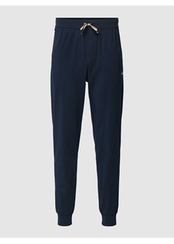 Spodnie dresowe o kroju regular fit z elastycznym pasem i tunelem ze sklepu Peek&Cloppenburg  w kategorii Spodnie męskie - zdjęcie 167697721