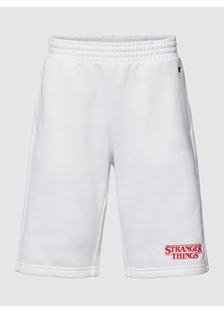Spodnie dresowe z wyhaftowanym logo — Champion x Stranger Things ze sklepu Peek&Cloppenburg  w kategorii Spodenki męskie - zdjęcie 167777293