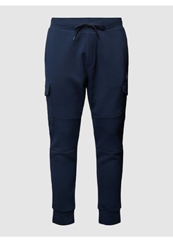 Spodnie dresowe z detalem z logo w jednolitym kolorze ze sklepu Peek&Cloppenburg  w kategorii Spodnie męskie - zdjęcie 167931302