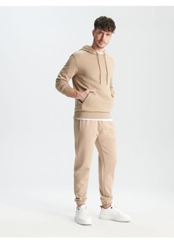 Sinsay - Spodnie dresowe jogger - beżowy ze sklepu Sinsay w kategorii Spodnie męskie - zdjęcie 167948204