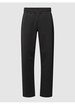 Spodnie dresowe o luźnym kroju z nadrukiem z logo ze sklepu Peek&Cloppenburg  w kategorii Spodnie męskie - zdjęcie 167964012