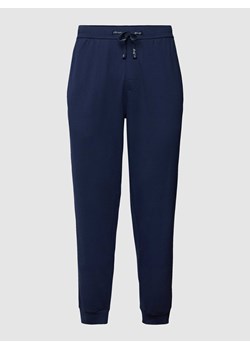 Spodnie dresowe z detalami z logo ze sklepu Peek&Cloppenburg  w kategorii Spodnie męskie - zdjęcie 168090693