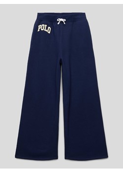 Spodnie dresowe z nadrukiem z logo ze sklepu Peek&Cloppenburg  w kategorii Spodnie dziewczęce - zdjęcie 168092470