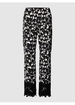 Spodnie materiałowe ze wzorem na całej powierzchni i obszyciem koronką ze sklepu Peek&Cloppenburg  w kategorii Spodnie damskie - zdjęcie 168148152