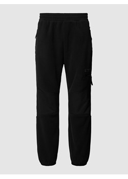 Spodnie dresowe z detalem z logo ze sklepu Peek&Cloppenburg  w kategorii Spodnie męskie - zdjęcie 168221434