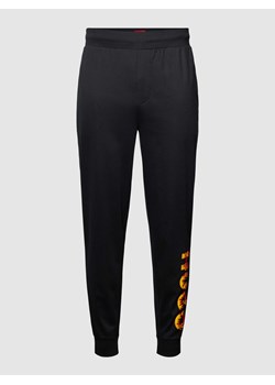 Spodnie dresowe z wyhaftowanym motywem z logo model ‘Flames’ ze sklepu Peek&Cloppenburg  w kategorii Spodnie męskie - zdjęcie 168223091