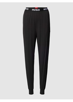 Spodnie dresowe z elastycznym pasem z logo model ‘UNITE’ ze sklepu Peek&Cloppenburg  w kategorii Piżamy damskie - zdjęcie 168316780