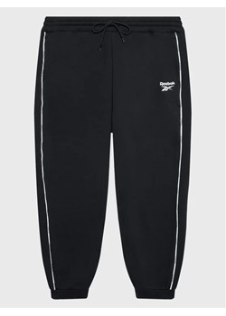 Reebok Spodnie dresowe Piping Pack HN4366 Czarny Regular Fit ze sklepu MODIVO w kategorii Spodnie damskie - zdjęcie 168401960