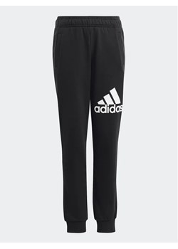 adidas Spodnie dresowe Essentials Big Logo Joggers HR6384 Czarny Regular Fit ze sklepu MODIVO w kategorii Spodnie chłopięce - zdjęcie 168411900