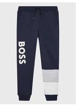 Boss Spodnie dresowe J24828 S Granatowy Regular Fit ze sklepu MODIVO w kategorii Spodnie chłopięce - zdjęcie 168416860