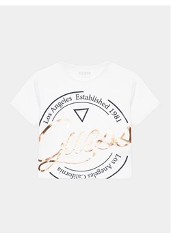 Guess T-Shirt J4GI01 K6YW4 Biały Boxy Fit ze sklepu MODIVO w kategorii Bluzki dziewczęce - zdjęcie 168463860