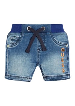 Guess Szorty jeansowe N3GD10 D4CA0 Niebieski Regular Fit ze sklepu MODIVO w kategorii Spodenki niemowlęce - zdjęcie 168467672
