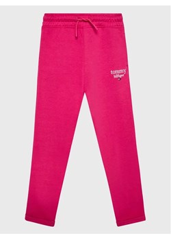 Tommy Hilfiger Spodnie dresowe Graphic KG0KG06866 D Różowy Regular Fit ze sklepu MODIVO w kategorii Spodnie dziewczęce - zdjęcie 168472684