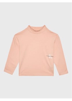 Calvin Klein Jeans Bluzka Monogram Off Placed IG0IG01791 Różowy Relaxed Fit ze sklepu MODIVO w kategorii Bluzki dziewczęce - zdjęcie 168474434