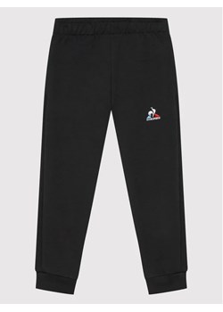 Le Coq Sportif Spodnie dresowe 2210487 Czarny Regular Fit ze sklepu MODIVO w kategorii Spodnie chłopięce - zdjęcie 168486592