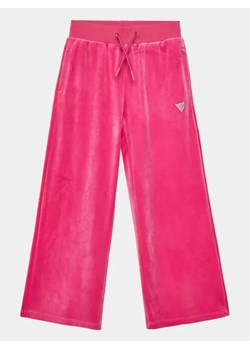 Guess Spodnie dresowe J4RQ16 KBXI2 Różowy Wide Leg ze sklepu MODIVO w kategorii Spodnie dziewczęce - zdjęcie 168487251