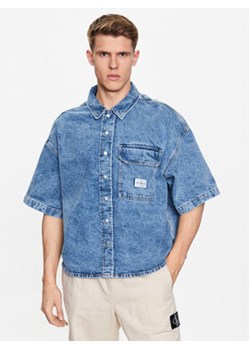 Calvin Klein Jeans Koszula jeansowa J30J322775 Niebieski Regular Fit ze sklepu MODIVO w kategorii Koszule męskie - zdjęcie 168535143