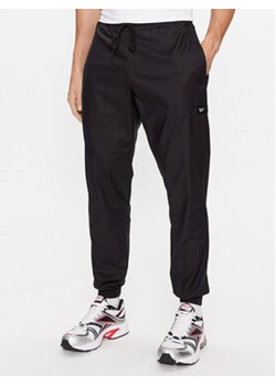 Reebok Spodnie dresowe Essentials II0695 Czarny Regular Fit ze sklepu MODIVO w kategorii Spodnie męskie - zdjęcie 168538751