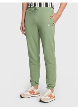 New Era Spodnie dresowe Essential 60284702 Zielony Relaxed Fit ze sklepu MODIVO w kategorii Spodnie męskie - zdjęcie 168548370