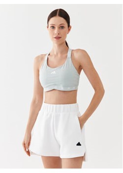 adidas Biustonosz sportowy PowerImpact Luxe Training Medium-Support Bra IL2880 Szary ze sklepu MODIVO w kategorii Biustonosze - zdjęcie 168556780