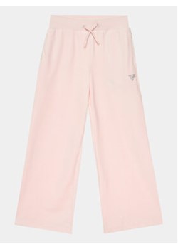 Guess Spodnie dresowe J4RQ16 KBXI2 Różowy Wide Leg ze sklepu MODIVO w kategorii Spodnie dziewczęce - zdjęcie 168557111
