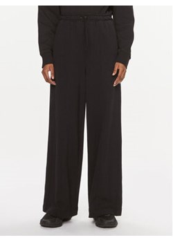 Calvin Klein Performance Spodnie dresowe 00GWS3P600 Czarny Wide Leg ze sklepu MODIVO w kategorii Spodnie damskie - zdjęcie 168559010