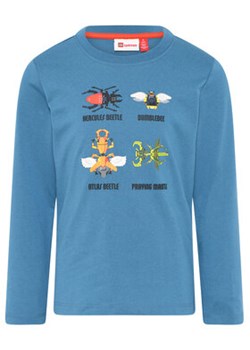 LEGO Bluzka 11010574 Niebieski Regular Fit ze sklepu MODIVO w kategorii T-shirty chłopięce - zdjęcie 168567420