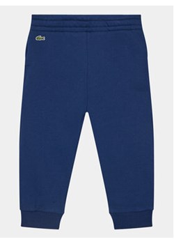 Lacoste Spodnie dresowe XJ1213 Granatowy Regular Fit ze sklepu MODIVO w kategorii Spodnie chłopięce - zdjęcie 168572103