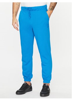 4F Spodnie dresowe 4FAW23TTROM453 Niebieski Regular Fit ze sklepu MODIVO w kategorii Spodnie męskie - zdjęcie 168576840