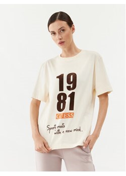 Guess T-Shirt V3BI00 KA260 Beżowy Regular Fit ze sklepu MODIVO w kategorii Bluzki damskie - zdjęcie 168578481