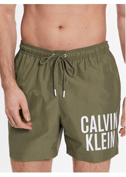 Calvin Klein Swimwear Szorty kąpielowe KM0KM00794 Beżowy Regular Fit ze sklepu MODIVO w kategorii Kąpielówki - zdjęcie 168600032