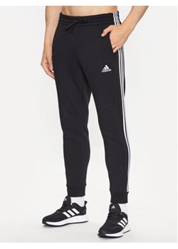 adidas Spodnie dresowe IB3999 Czarny Slim Fit ze sklepu MODIVO w kategorii Spodnie męskie - zdjęcie 168603573