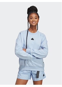 adidas Bluza City Escape Loose Crew Sweatshirt IC0278 Niebieski Loose Fit ze sklepu MODIVO w kategorii Bluzy damskie - zdjęcie 168610630