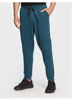 4F Spodnie dresowe H4Z22-SPMD012 Granatowy Regular Fit ze sklepu MODIVO w kategorii Spodnie męskie - zdjęcie 168611610