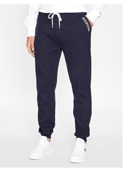 Tommy Hilfiger Spodnie dresowe UM0UM03097 Granatowy Regular Fit ze sklepu MODIVO w kategorii Spodnie męskie - zdjęcie 168614720
