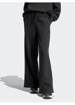 adidas Spodnie dresowe IR8377 Czarny Loose Fit ze sklepu MODIVO w kategorii Spodnie damskie - zdjęcie 168618142