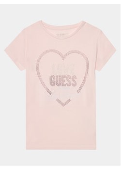 Guess T-Shirt J4RI35 K6YW4 Różowy Boxy Fit ze sklepu MODIVO w kategorii Bluzki dziewczęce - zdjęcie 168631524