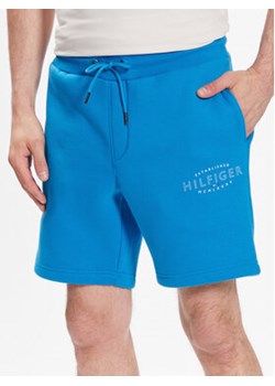 Tommy Hilfiger Szorty sportowe Curve Logo MW0MW30014 Niebieski Regular Fit ze sklepu MODIVO w kategorii Spodenki męskie - zdjęcie 168636960