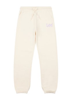 Lee Spodnie dresowe Wobbly Graphic LEG5001 Beżowy ze sklepu MODIVO w kategorii Spodnie dziewczęce - zdjęcie 168639940