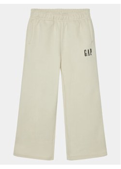 Gap Spodnie dresowe 739992-00 Beżowy Relaxed Fit ze sklepu MODIVO w kategorii Spodnie dziewczęce - zdjęcie 168644761
