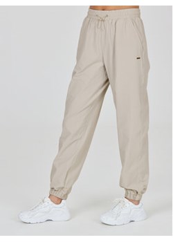 Athlecia Spodnie dresowe Hero W Track Pants EA233336 Szary Regular Fit ze sklepu MODIVO w kategorii Spodnie męskie - zdjęcie 168645494