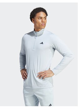 adidas Koszulka techniczna Train Essentials Seasonal Training IJ9620 Niebieski Regular Fit ze sklepu MODIVO w kategorii T-shirty męskie - zdjęcie 168648353